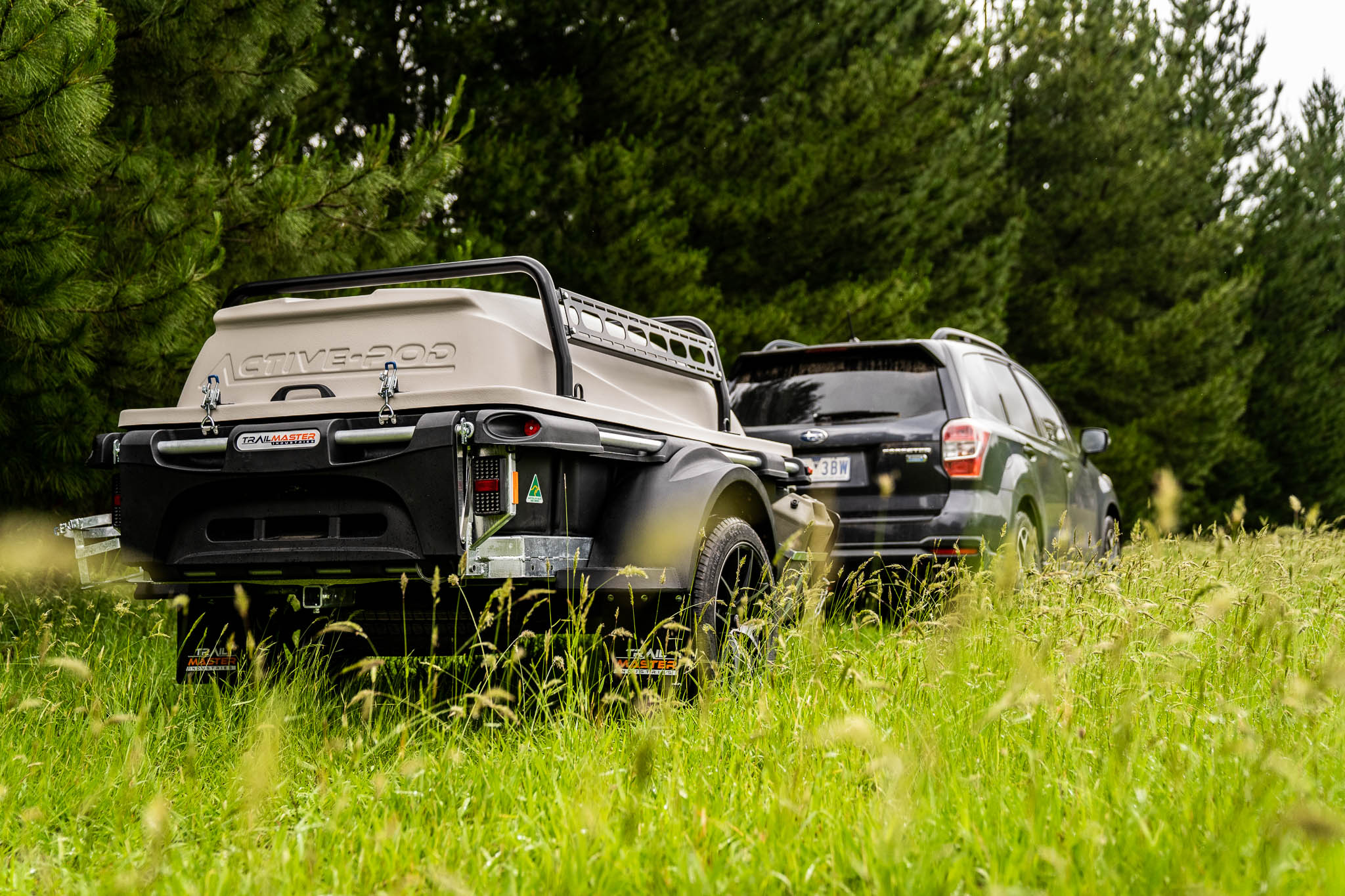 ACTIVE POD trailer being towed through scenic countryside - protected, ready, and easy to tow