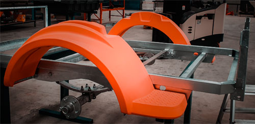 Expert craftsman building POD trailer fenders in factory